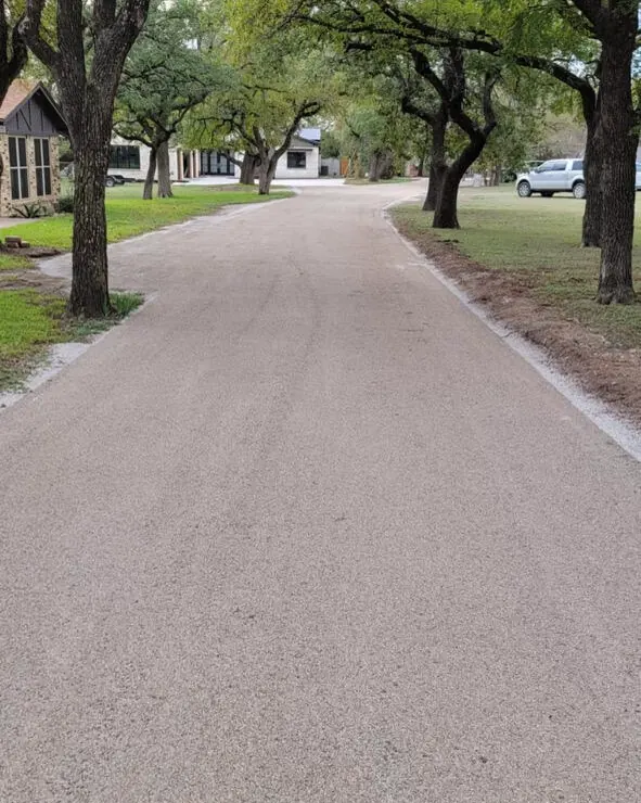 Chip seal drive lined with live oaks